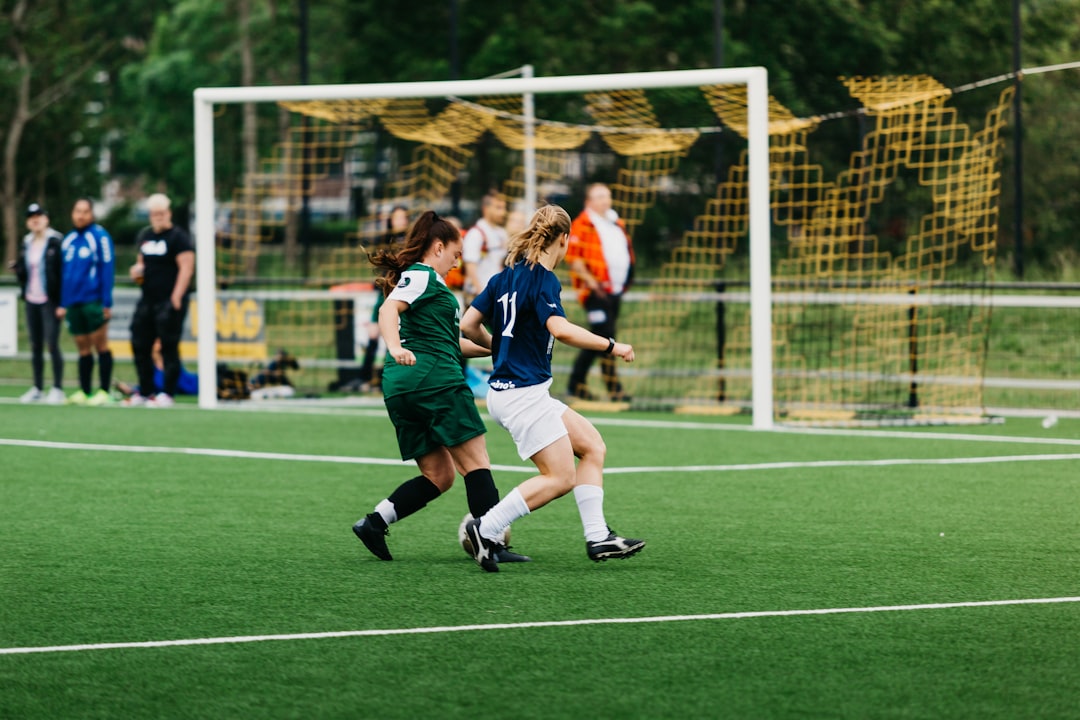 women-playing-soccer-on-green-field-during-daytime-tsyzva0e2pq